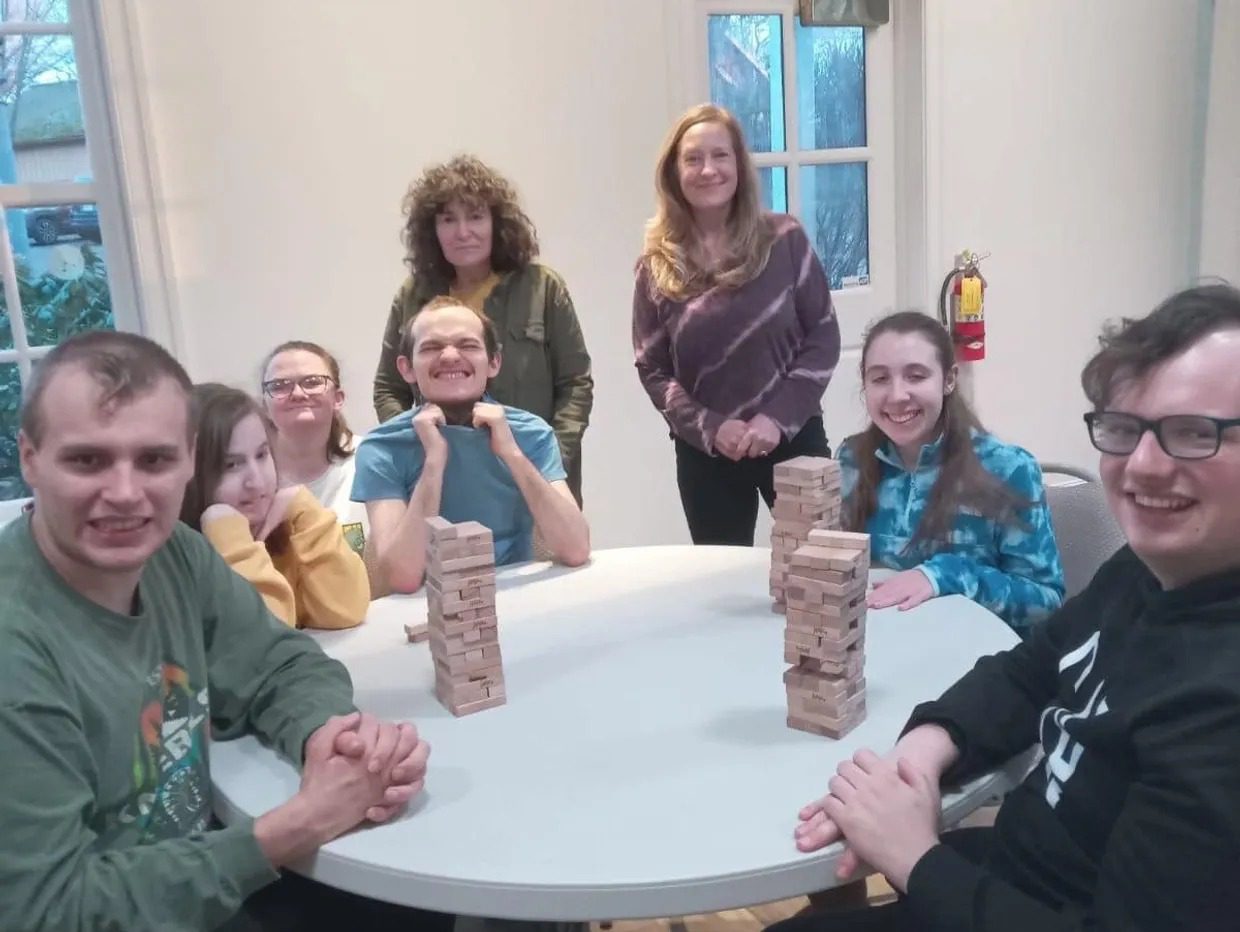 Friends enjoying a Jenga game together